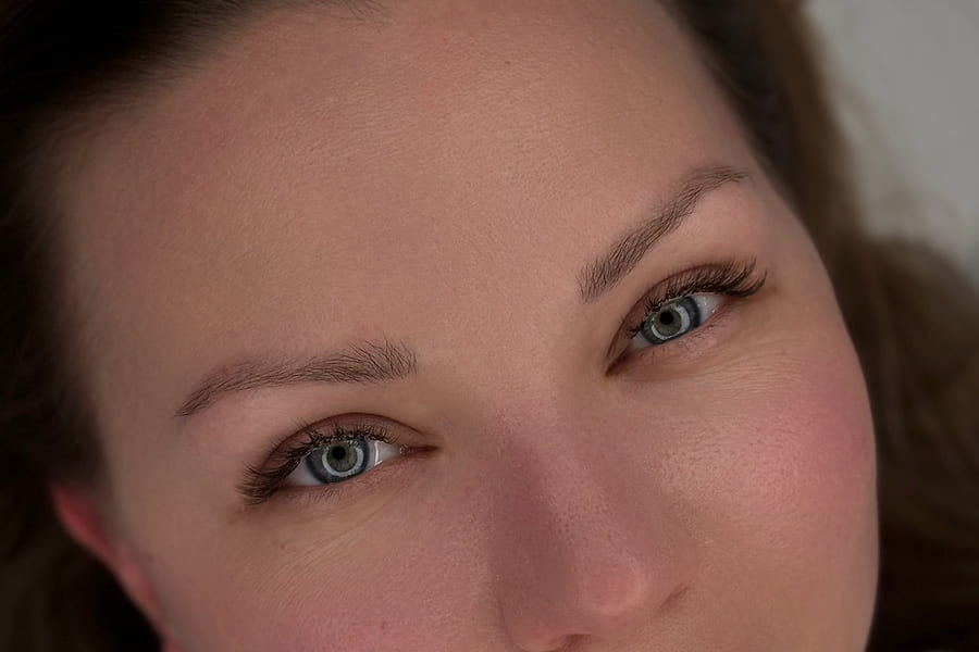Sculpted and tinted brows, mapped and shaped to the client's features