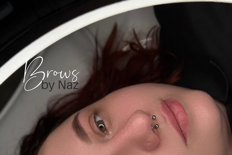 Healed ombré powder brows, softly shaded from a light front to a defined tail